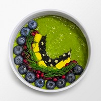 Smoothie bowl on white background, food photography, flat lay style