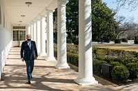President Joe Biden walks along to the Colonnade of the White House Saturday, Feb. 20, 2021, en route to the Oval Office.