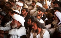 Afghan farmers listen to the Nawa District governor