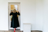 First Lady Jill Biden waits at the window outside the Oval Office of the White House Wednesday, March 24, 2021, to scare President Joe Biden. (Official White House Photo by Cameron Smith). Original public domain image from Flickr