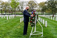President Joe Biden lays a wreath and observes a moment of silence during a visit to Section 60 Wednesday, April 14, 2021, at Arlington National Cemetery in Arlington, Virginia. (Official White House Photo by Cameron Smith). Original public domain image from Flickr