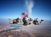 U.S. Marine Corps military free fall instructors assigned to Marine Detachment - Fort Bragg release the ashes of Sgt. Brett Jaffe, a Marine rigger, over Phillips Drop Zone at Yuma Proving Grounds, Ariz., July 26, 2012.