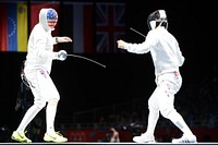 U.S. Air Force Capt. Seth Kelsey, left, competes in the Olympic men's epee individual bronze medal fencing match against Jung Jinsun from South Korea Aug. 1, 2012, at ExCel South Arena in London.