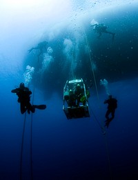 U.S. Navy divers, assigned to Company 4, Mobile Diving and Salvage Unit 2, and the Joint POW/MIA Accounting Command (JPAC), conduct an underwater recovery operation in the Mediterranean Sea Oct. 19, 2012, in search of an unaccounted-for service member who went missing during World War II. The team was embarked aboard salvage ship USNS Grapple (T-ARS 53) during a 30-day recovery mission.