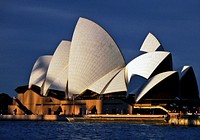 The Sydney Opera HouseShaded by The Harbour Bridge. The Sydney Opera House is a multi-venue performing arts centre in Sydney, New South Wales, Australia. It is one of the 20th century's most famous and distinctive buildings. Original public domain image from Flickr