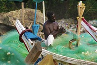 Fish Boosts Food Security. A fisherman mends his nets in Ghana's Cape Coast.USAID’s integrated coastal fisheries governance project has assisted the Government of Ghana and key stakeholders in strengthening their capacity to conserve and protect marine fisheries.These fisheries are a critical resource in Ghana, where 60 percent of animal protein comes from marine fisheries and 2.2 million people depend on them for their livelihoods.As such, fish play an important role in Ghana’s food security. They are often the only accessible and affordable source of animal protein for poor households in urban and peri-urban areas.Fish is also smoked and dried and transported to the rural regions in the northern part of the country, where it is a critical source of protein and micro-nutrients such as iron, iodine, zinc, calcium, vitamin A and vitamin B.