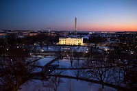 The White House is illuminated at sunset, Jan. 22, 2014.