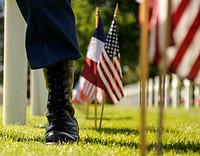 Colleville-sur-Mer, France – A U.S. Army paratrooper stands watch in the American Cemetery in Normandy, France after a ceremony to honor World War II veterans as part of the 70th Anniversary of D-Day, June 6, 2014.