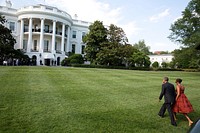 President Barack Obama and First Lady Michelle Obama walk from Marine One on the South Lawn upon arrival at the White House following a trip to California, June 16, 2014.