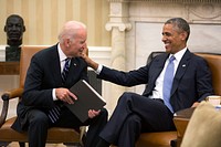 President Barack Obama and Vice President Joe Biden share a laugh in the Oval Office July 21, 2014.