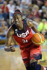 United States Women's National Basketball Team play an inter-squad exhibition game at the University of Delaware. Military personnel and the Basketball Team exchange “dog-tags” and coins during halftime ceremony. Original public domain image from Flickr