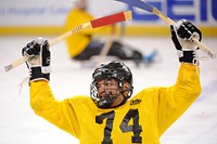 Air Force Master Sgt. Axel Gaud-Torres reacts to playing a game of sled hockey at the World Arena in Colorado Springs Oct. 2, 2014.