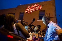 July 29, 2014: "Sometimes you get lucky as a photographer. The President was greeting the crowd outside Arthur Bryant's Barbeque in Kansas City. As he began talking to a young boy, actually giving him some life advice, someone's smart phone briefly illuminated the President's face. Without this light, the photograph wouldn't have been nearly as successful."