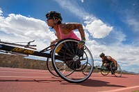 Army Staff Sgt. Monica Martinez, left, And Army Staff Sgt. Vestor ‘Max’ Hasson compete, but in separate 1500 meter wheelchair race categories during the Army Trials at Fort Bliss in El Paso, Texas April 1, 2015.