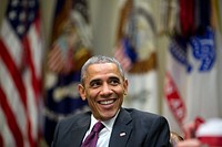 President Barack Obama laughs during a meeting in the Roosevelt Room of the White House, Nov. 17, 2014.