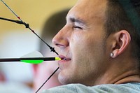 Army Sgt. Robbie Gaupp competes in archery at the Army Trials at Fort Bliss in El Paso, Texas March 31, 2015. Athletes at the trials are competing for a spot on the Army's team for the 2015 Department of Defense Warrior Games. Original public domain image from Flickr