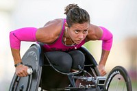 Army Capt. Kelly Elminger does laps in her race wheelchair at Joint Base San Antonio June 11, 2015 while training for the 2015 Department of Defense Warrior Games. Original public domain image from Flickr