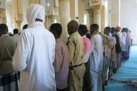 Residents of Mogadishu, Somalia pray at the Isbahesiga Mosque during Eid Al-fitr Day which marked the end of the Muslim holy month of Ramadan on July 17 2015.AMISOM Photo / Ilyas Ahmed. Original public domain image from Flickr