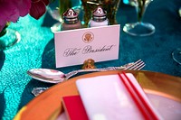 President Barack Obama's place is set at the table prior to the State Dinner for Prime Minister Shinzo Abe of Japan in the East Room of the White House, April 28, 2015.