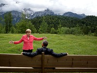 "We were at the G7 Summit in Krün, Germany. Chancellor Angela Merkel asked the leaders and outreach guests to make their way to a bench for a group photograph. The President happened to sit down first, followed closely by the Chancellor. I only had time to make a couple of frames before the background was cluttered with other people."