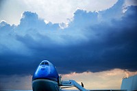 "Underneath a picturesque sky, the President boards Air Force One prior to departure from John F. Kennedy International Airport in New York."(Official White House Photo by Pete Souza).Original public domain image from Flickr