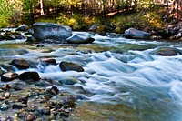 Whychus Creek flowing over boulders on the Deschutes National Forest in Central Oregon. Original public domain image from Flickr