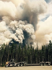 Rail Fire burning behind staged equipment, Wallowa Whitman and Malheur National Forest. Original public domain image from Flickr