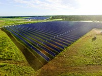 A 2.2 MW sub-array at the Old Midville solar project in Millen, Georgia. This image was taken on the first full day of energy being injected into the grid. Original public domain image from Flickr