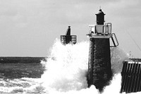 Large waves crashing into lighthouse. Free public domain CC0 image.