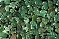 Green stones texture background, pebbles pile 