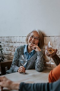 Retired couple drinking wine at bar