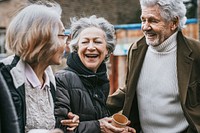 Retired friends walking together in the city