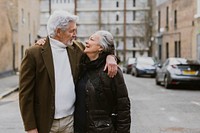 Senior couple walking in British town