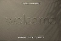 Embossed editable vector text effect on brown