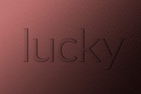 Lucky emboss typography psd on paper texture