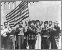 San Francisco, Calif., April 1942. Children at the Weill public school for the so-called international settlement and including many Japanese-Americans, saluting the flag. They include evacuees of Japanese descent who will be housed in War relocation authority centers for the duration. Sourced from the Library of Congress.