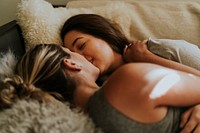 Lesbian couple together in bed