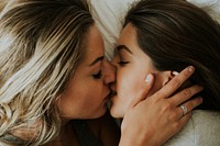 Lesbian couple kissing in the morning
