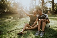 Gay couple taking a selfie in the summer