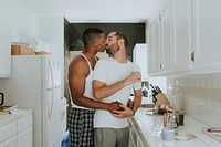 Gay couple kissing in the kitchen