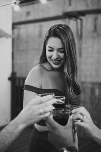 Beautiful girl toasting with her friends