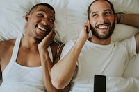 Couple listening to music in bed