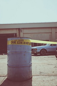 Close up of a barrel with crime scene tape