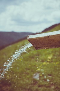 Water flowing from wooden pipe