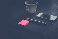 Notebook and phone on a table