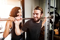 Couple working out together at the gym