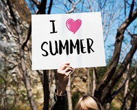 Young woman holding a poster with a summer graphic