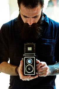 Photographer using a vintage camera