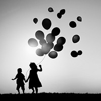 Kids playing with balloons
