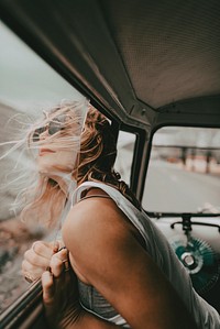 Boho woman road trip portrait in a minivan, travel HD photo